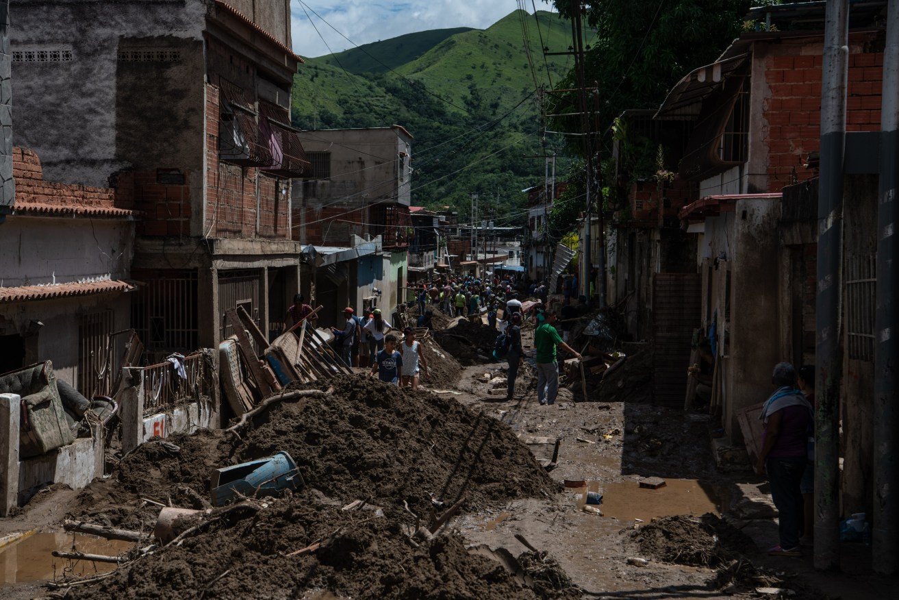 Rescue workers continue to look for survivors after floods and a landslide devastated the Venezuelan city of Las Tejerias and left at least 34 people dead.