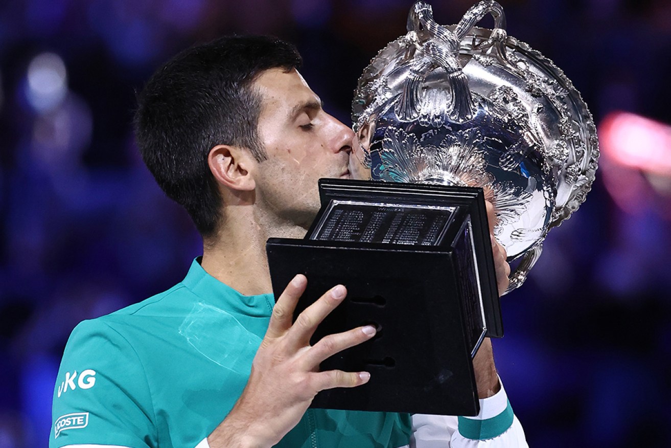 Novak Djokovic seals another Australian Open win with a kiss.