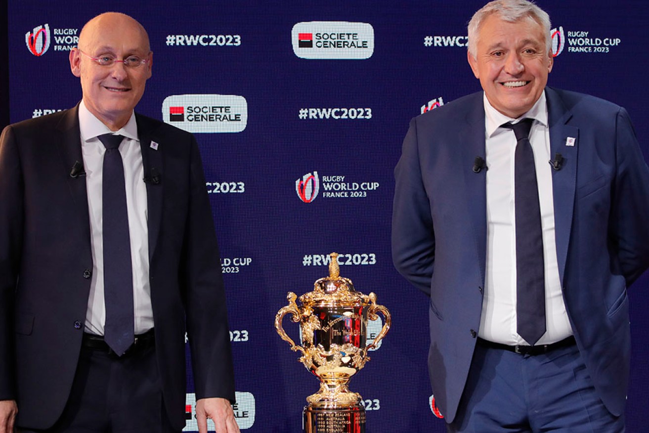 Claude Atcher, right, with French rugby head Bernard Laporte, has been sacked as World Cup CEO.