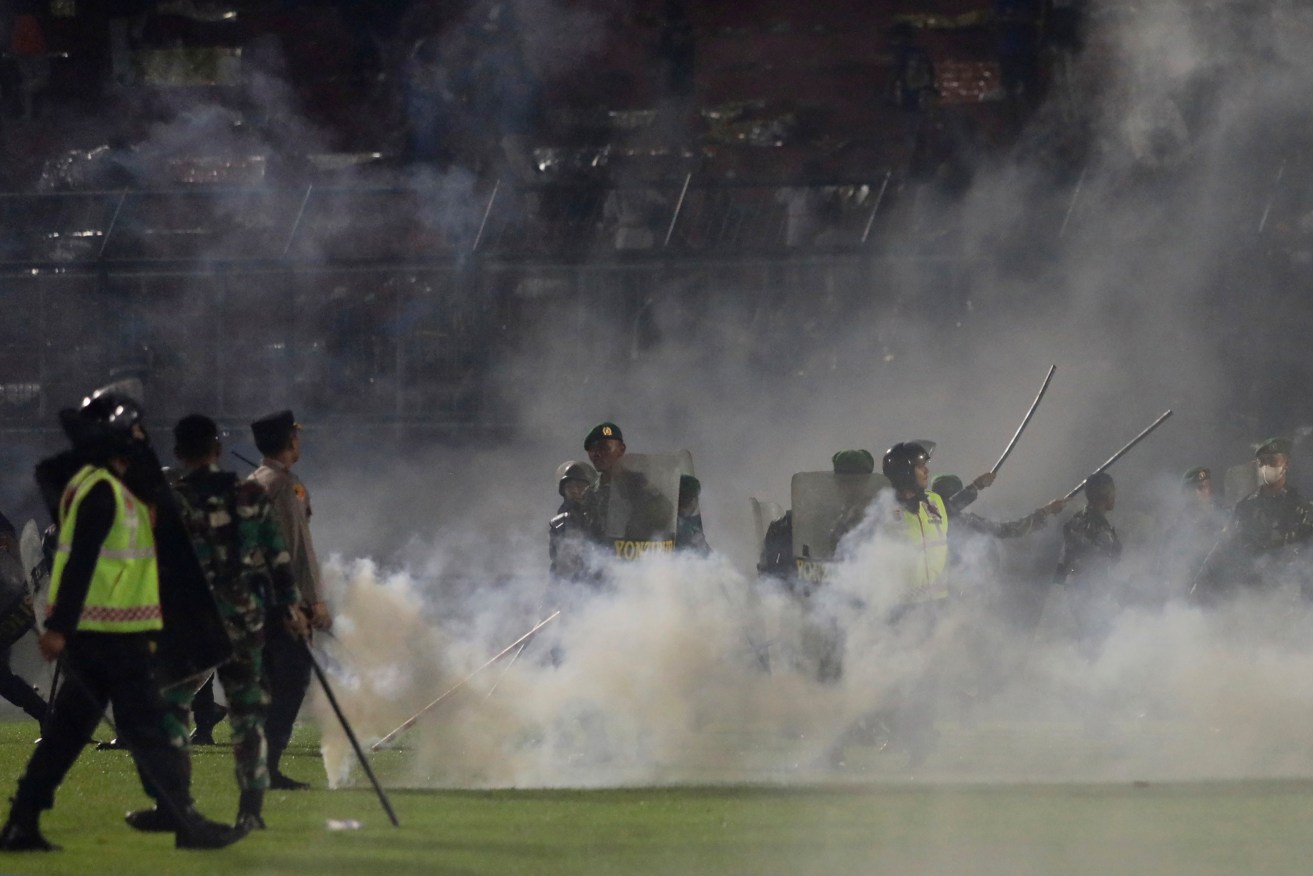 The firing of tear gas triggered a fatal stampede at an Indonesian soccer match earlier this month. 