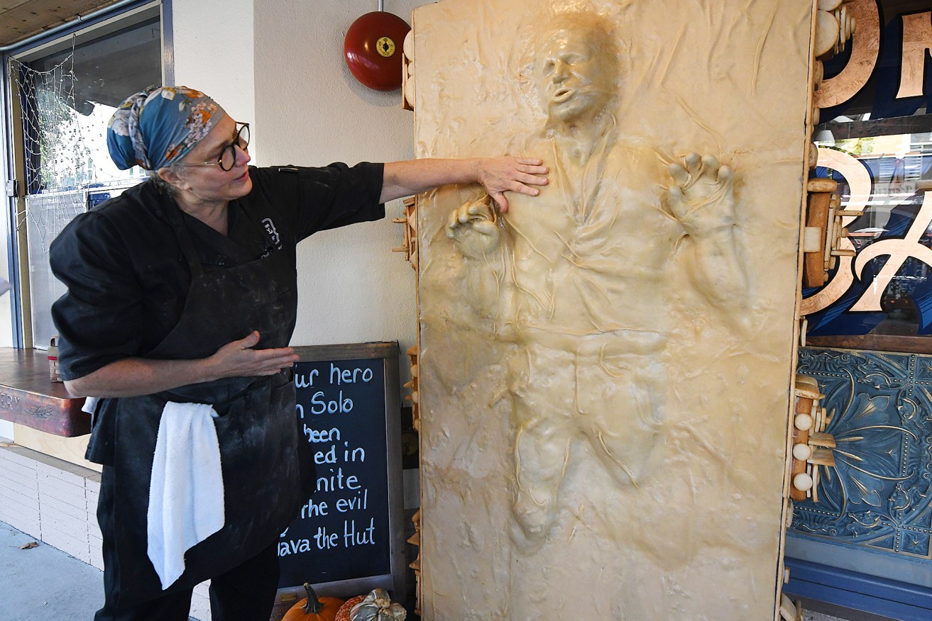 Catherine Pervan admires her bakery's creation of Han Solo.