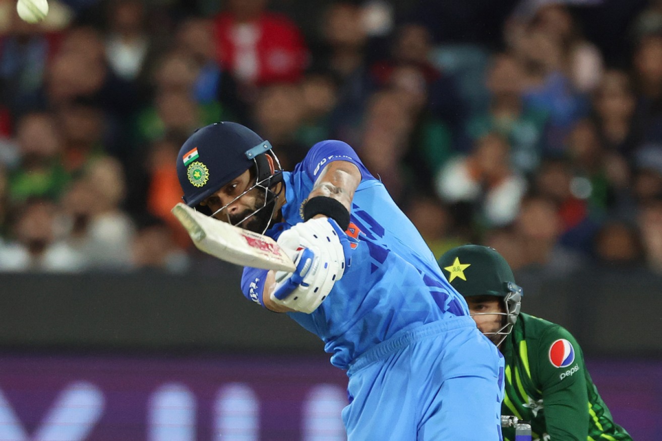 Virat Kohli hits a six during his match-winning World Cup knock against Pakistan at the MCG. 