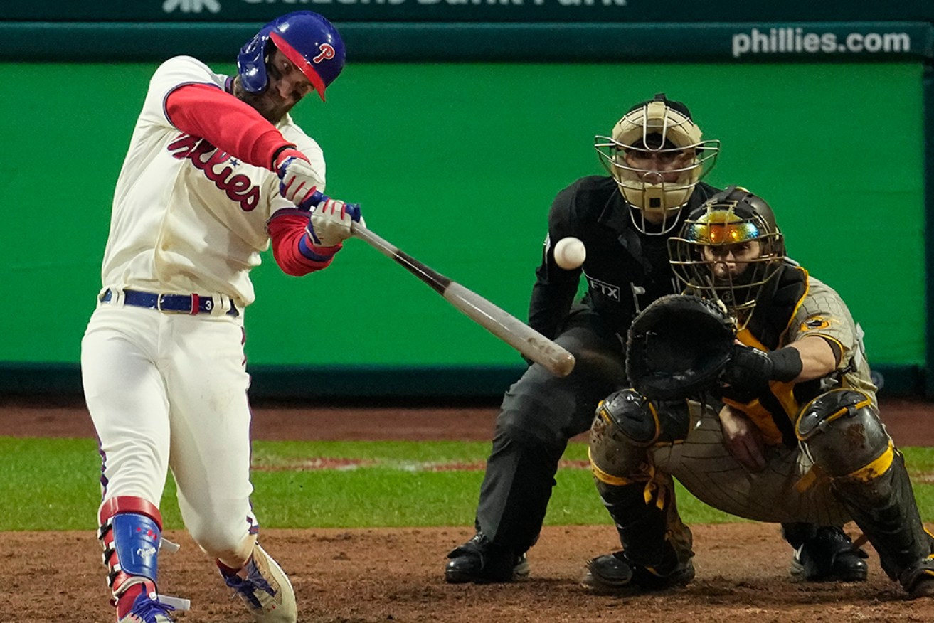 Philadelphia Phillies' Bryce Harper slams a two-run homer to lead his team into the World Series.