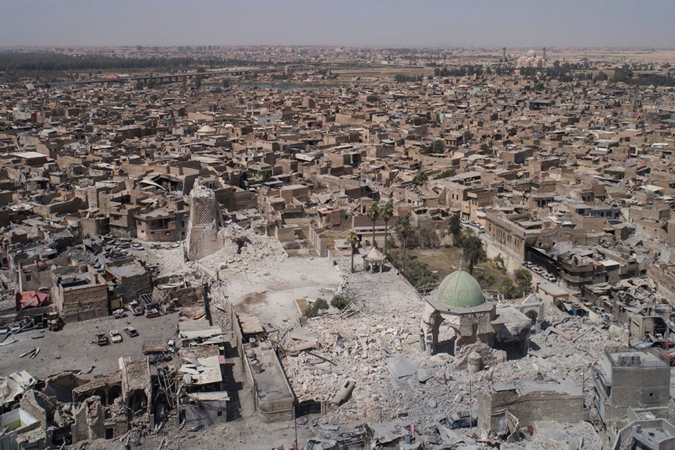 Archaeologists in Mosul, pictured in 2017, have found 2700-year-old carvings as they work to restore an ancient gate.