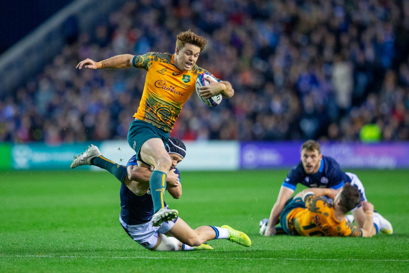 Australia's Andrew Kellaway tackled by Scotland's Darcy Graham in the Wallabies' narrow win.