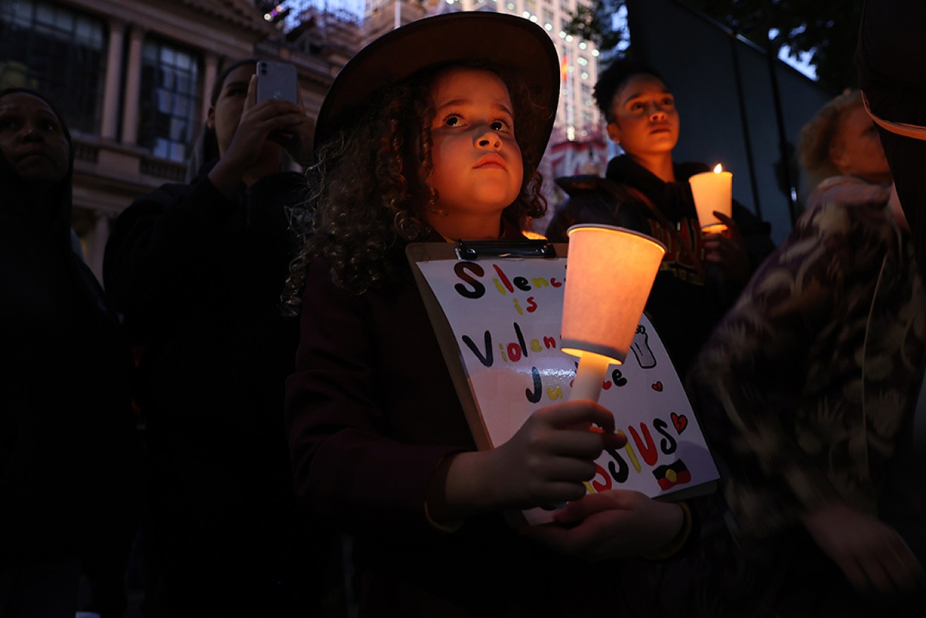 Young supporters during a candlelight vigil for Cassius Turvey at Sydney Town Hall.