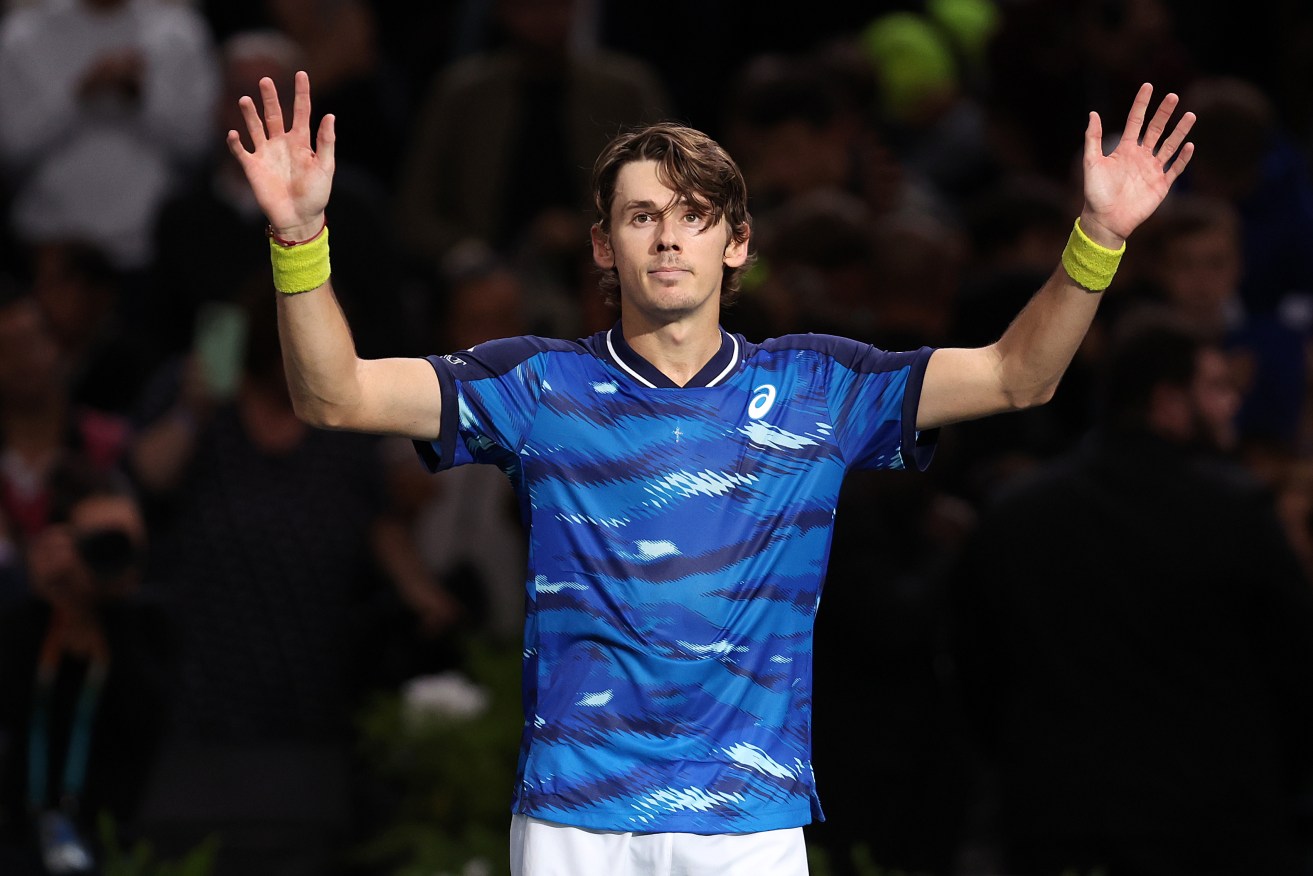 Alex de Minaur soaks up the cheers after his breakthrough triumph over Daniil Medvedev in Paris.
