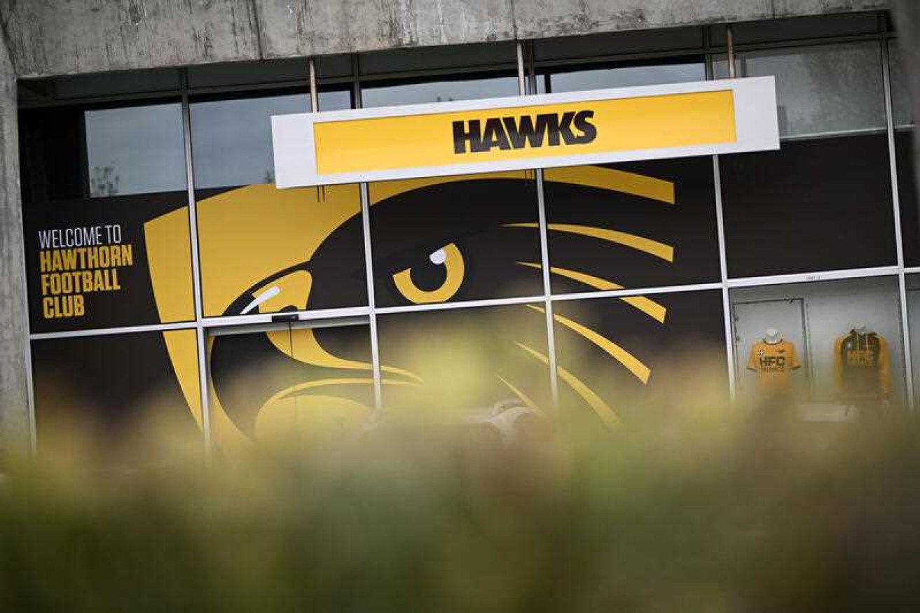 Four players and their families have reportedly agreed to take part in the Hawthorn racism inquiry. 