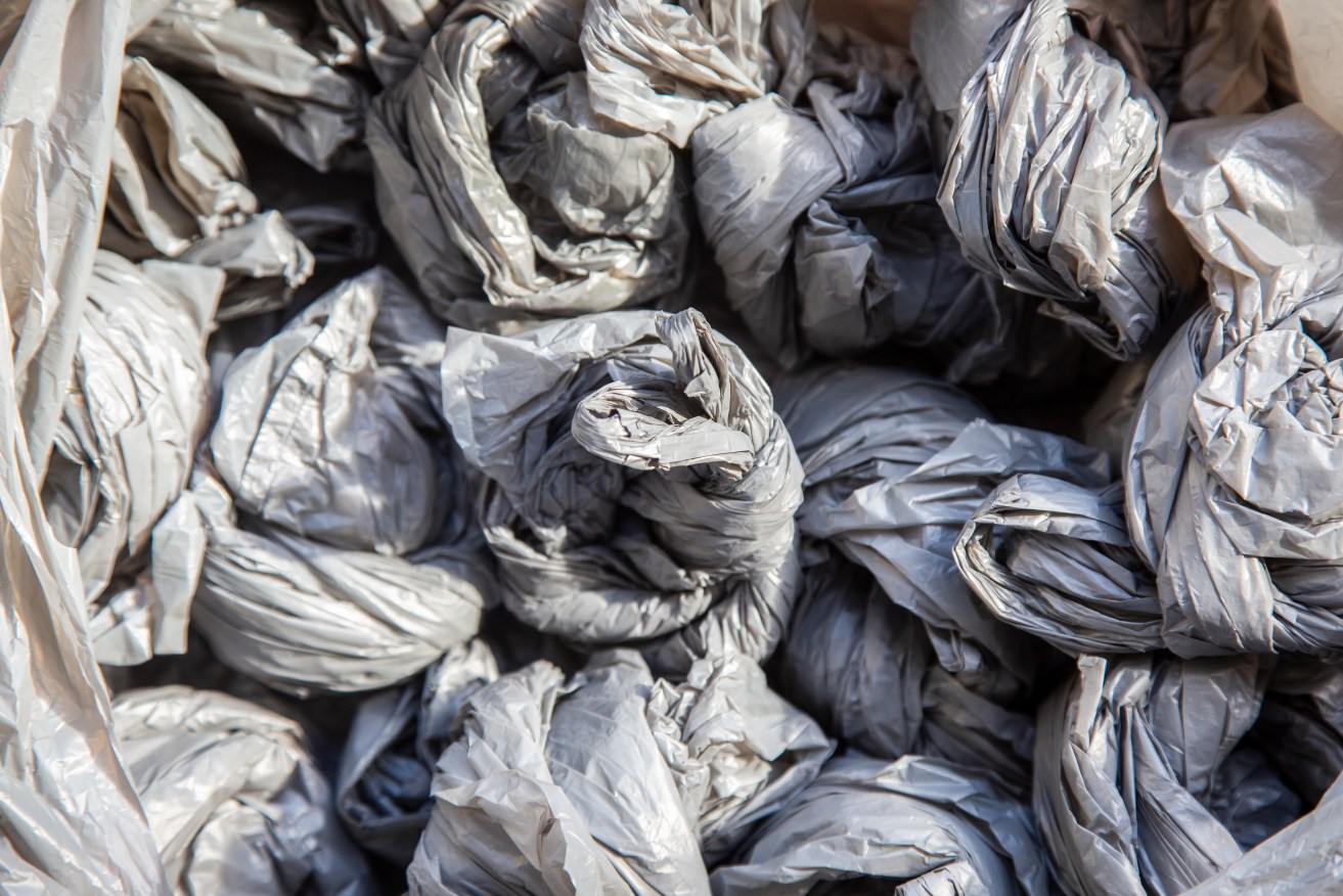 Two big supermarkets say they will take responsibility for thousands of tonnes of soft plastic stashed in warehouses across Australia.