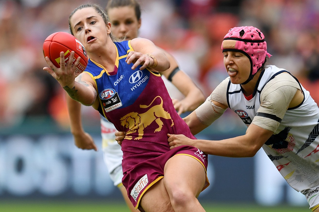 The AFLW is mourning the death of Adelaide premiership-winning player Heather Anderson, right.  