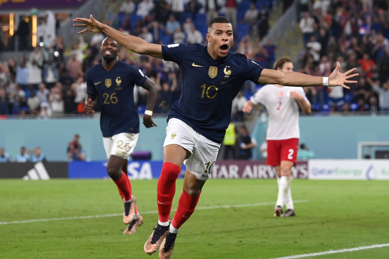 Kylian Mbappe celebrates after scoring France's second goal against Denmark.
