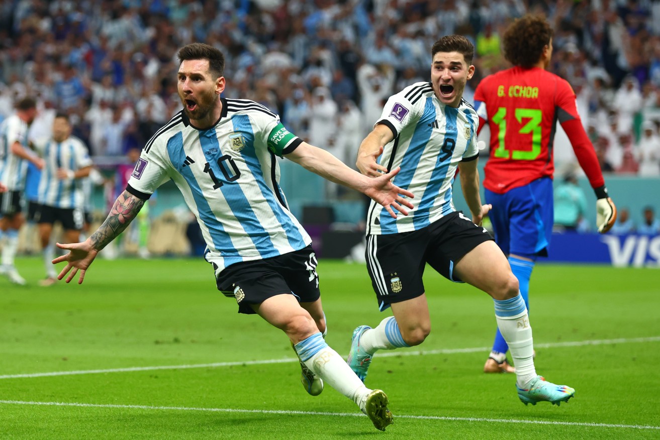 Lionel Messi scores Argentina's first goal in their win against Mexico.