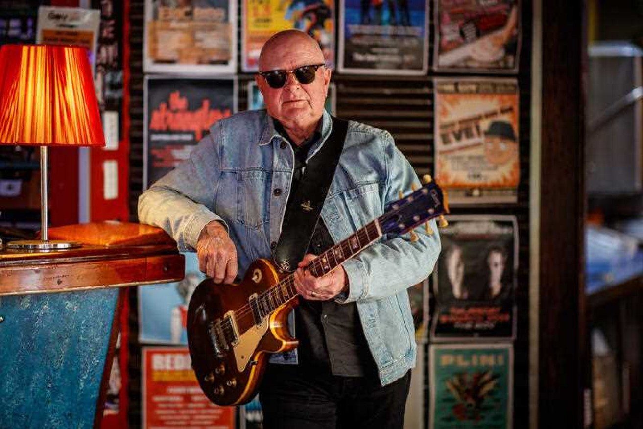 A documentary about rock band The Angels has unflattering assessments of guitarist John Brewster.