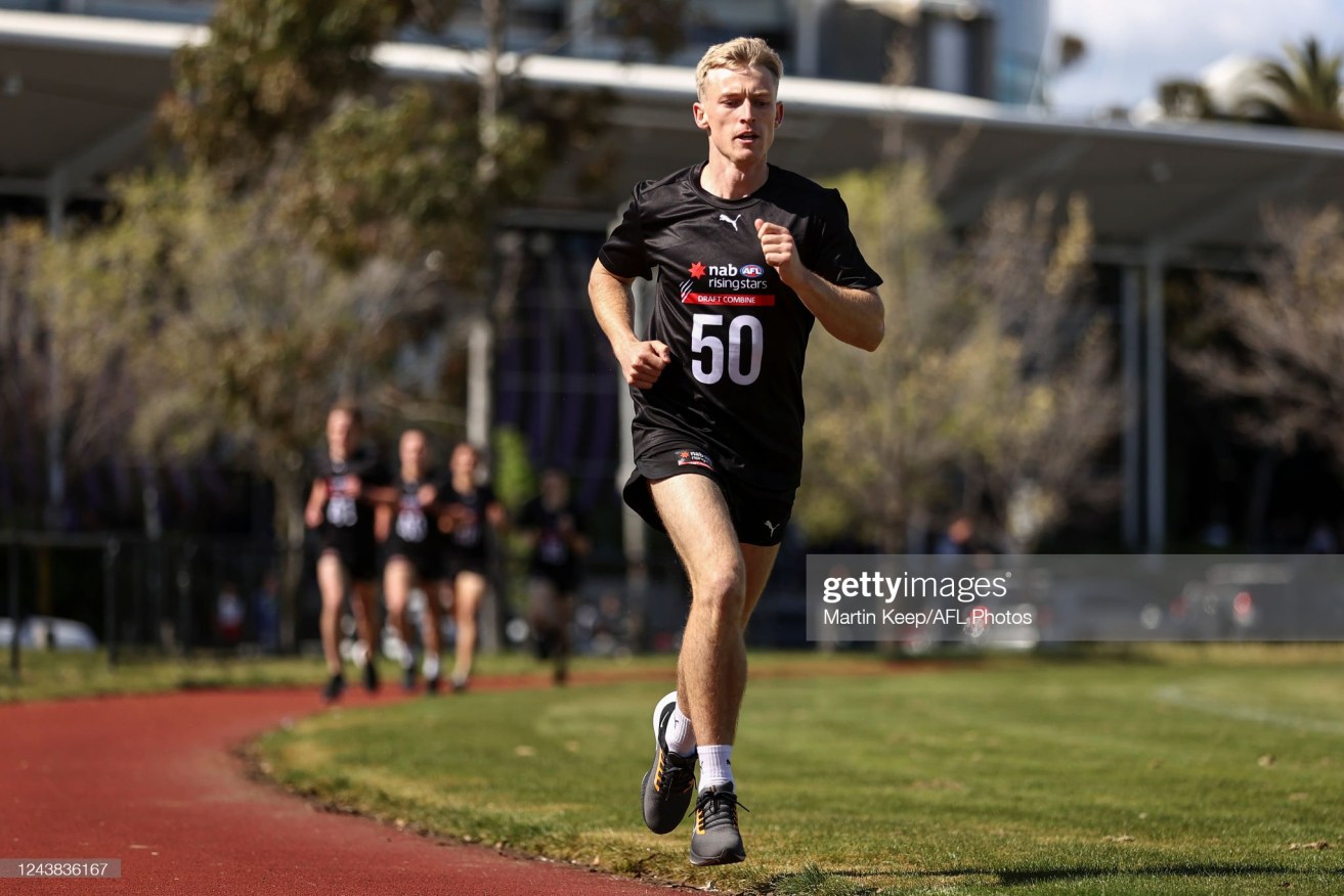 Joe Richards completes the 2km time-trial during the 2022 AFL Draft Combine in October. The 23-year-old was a shock selection by Collingwood in the AFL draft.