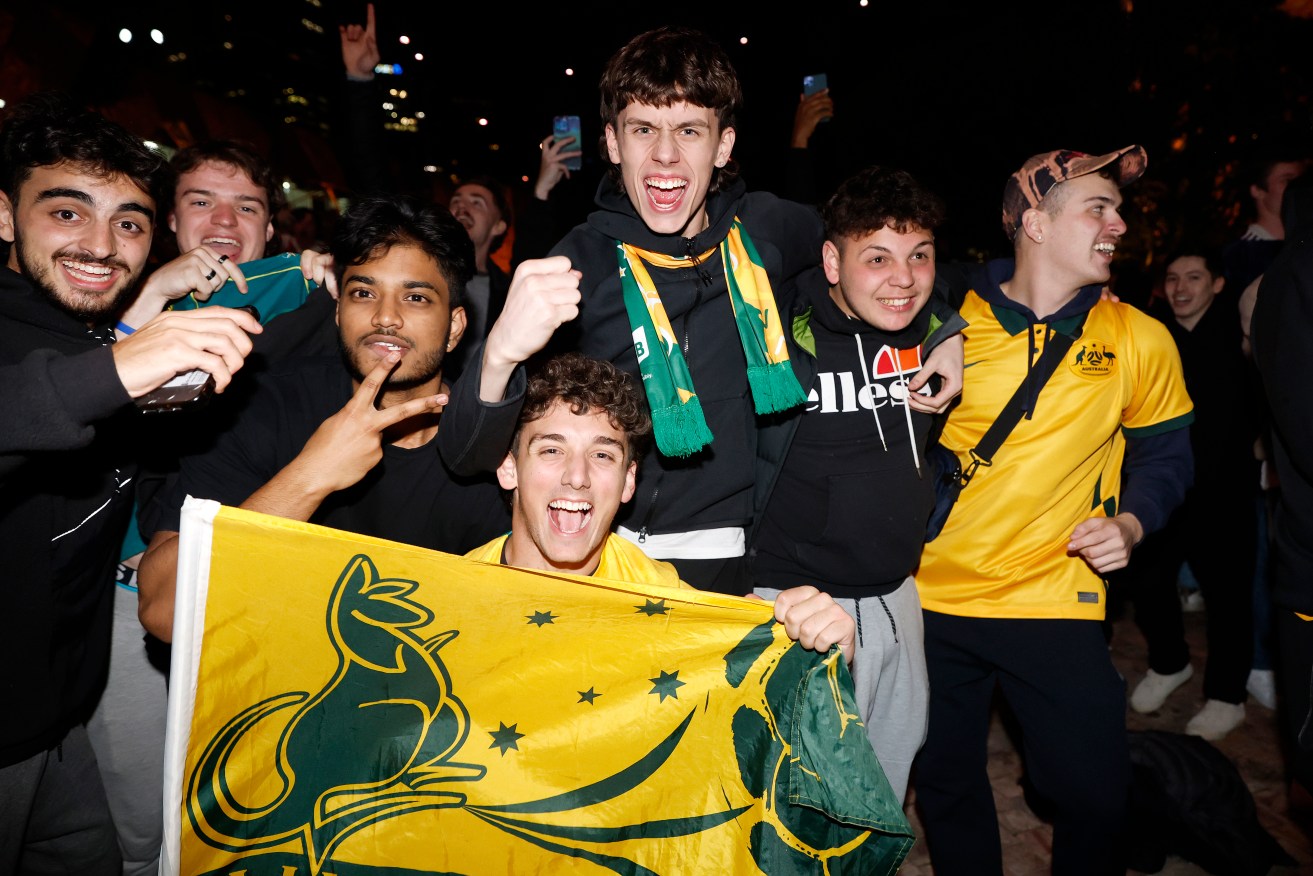 Jubilant Socceroos fans in Melbourne's Federation Square.