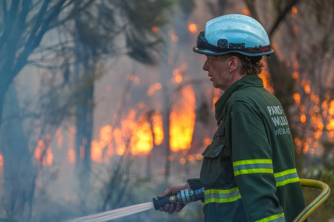 A fire on Flinders Island in Bass Strait is burning out of control with two communities at risk.