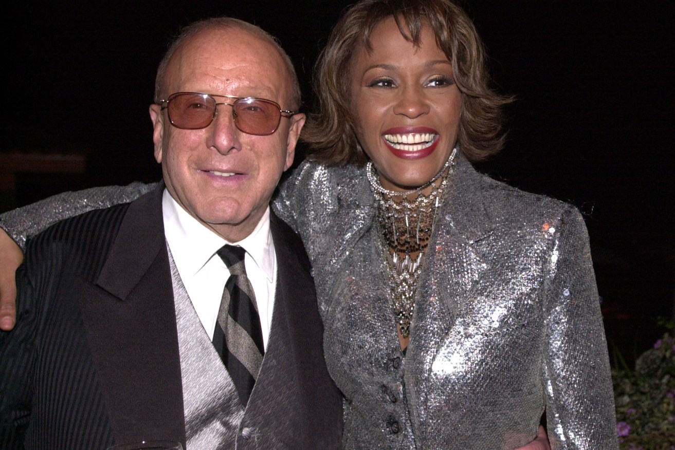 Clive Davis has promised the upcoming Whitney Houston biopic will answer a lot of questions.