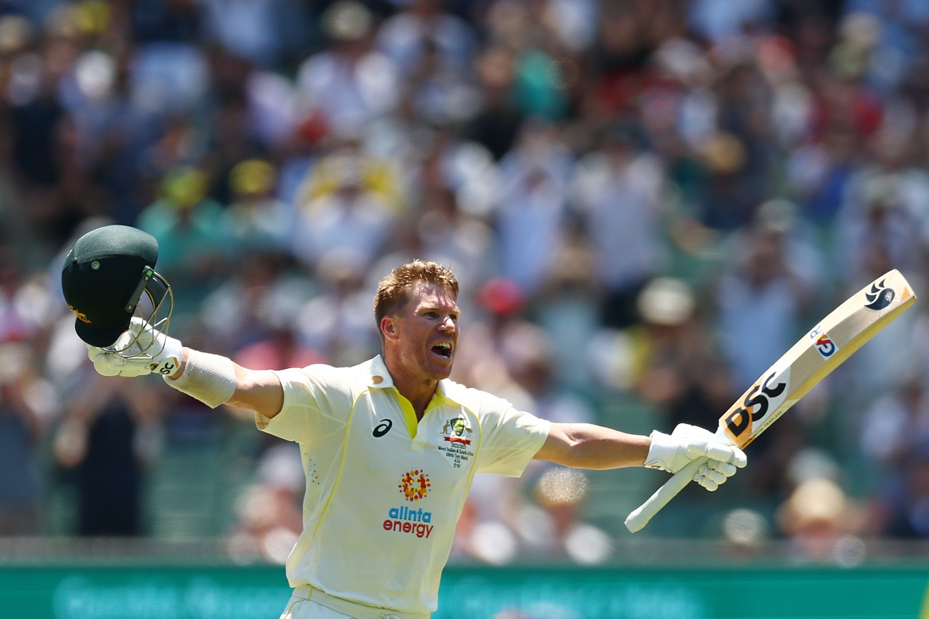 Australia's David Warner celebrates scoring his first Test hundred in nearly three years.