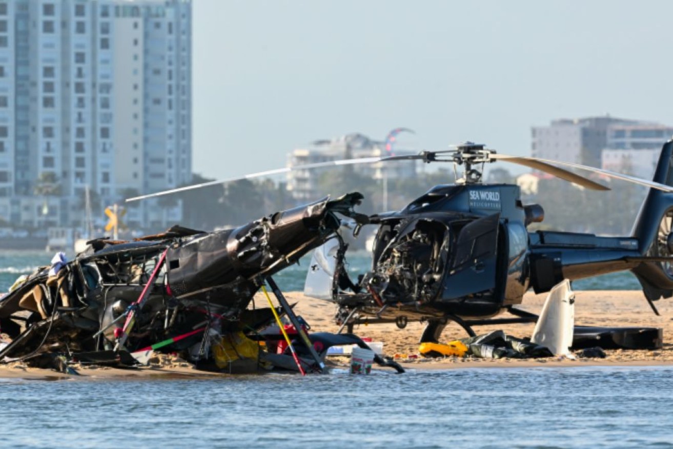 A final report into the mid-air crash between two helicopters is not expected before September 2024.