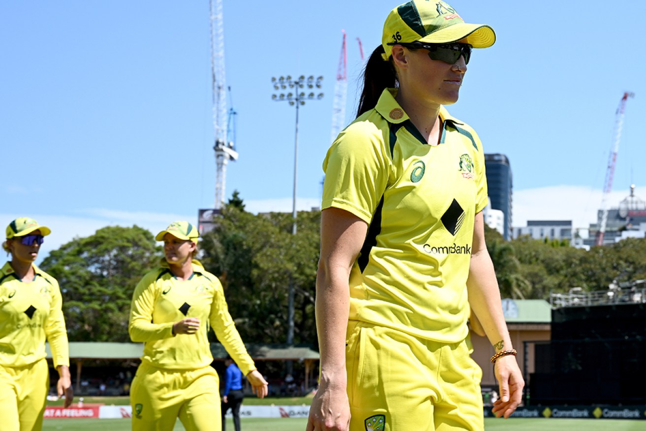 Megan Schutt leads Australia off the field after taking 5-15 against Pakistan at North Sydney.