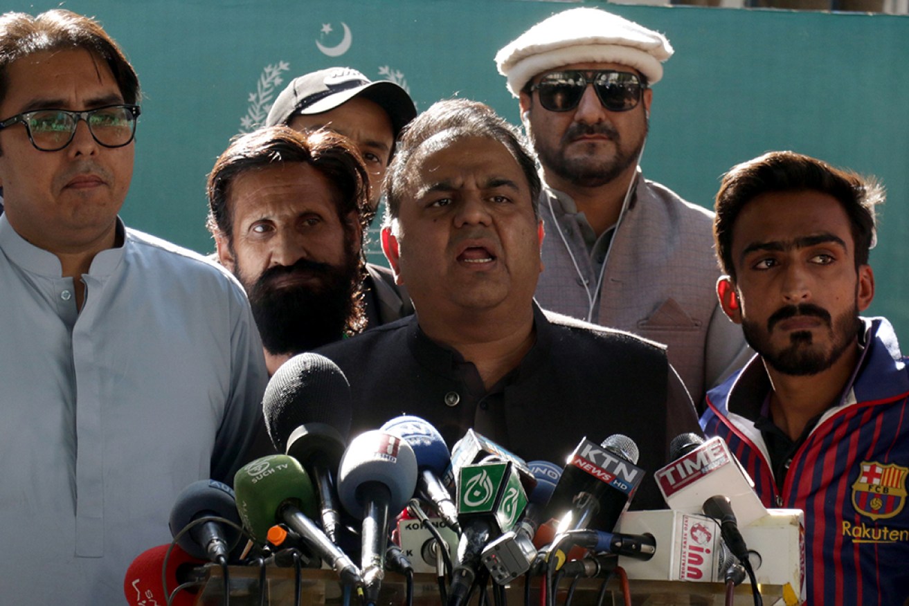 Tehreek-e-Insaf party vice president Fawad Chaudhry (centre) has been arrested in Pakistan. 