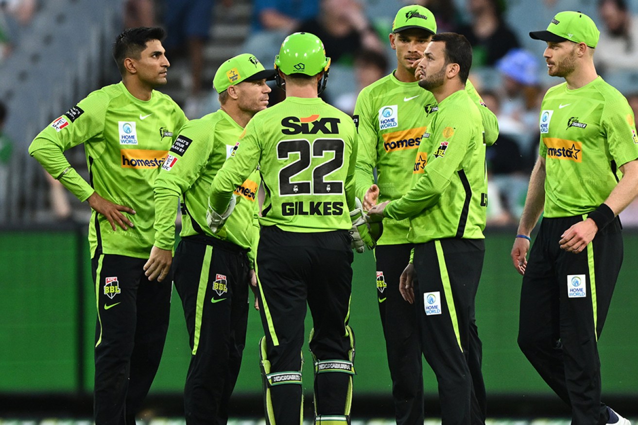 Usman Qadir (second from right) took 3-24 to help Sydney Thunder beat Melbourne Stars and reach the BBL finals.