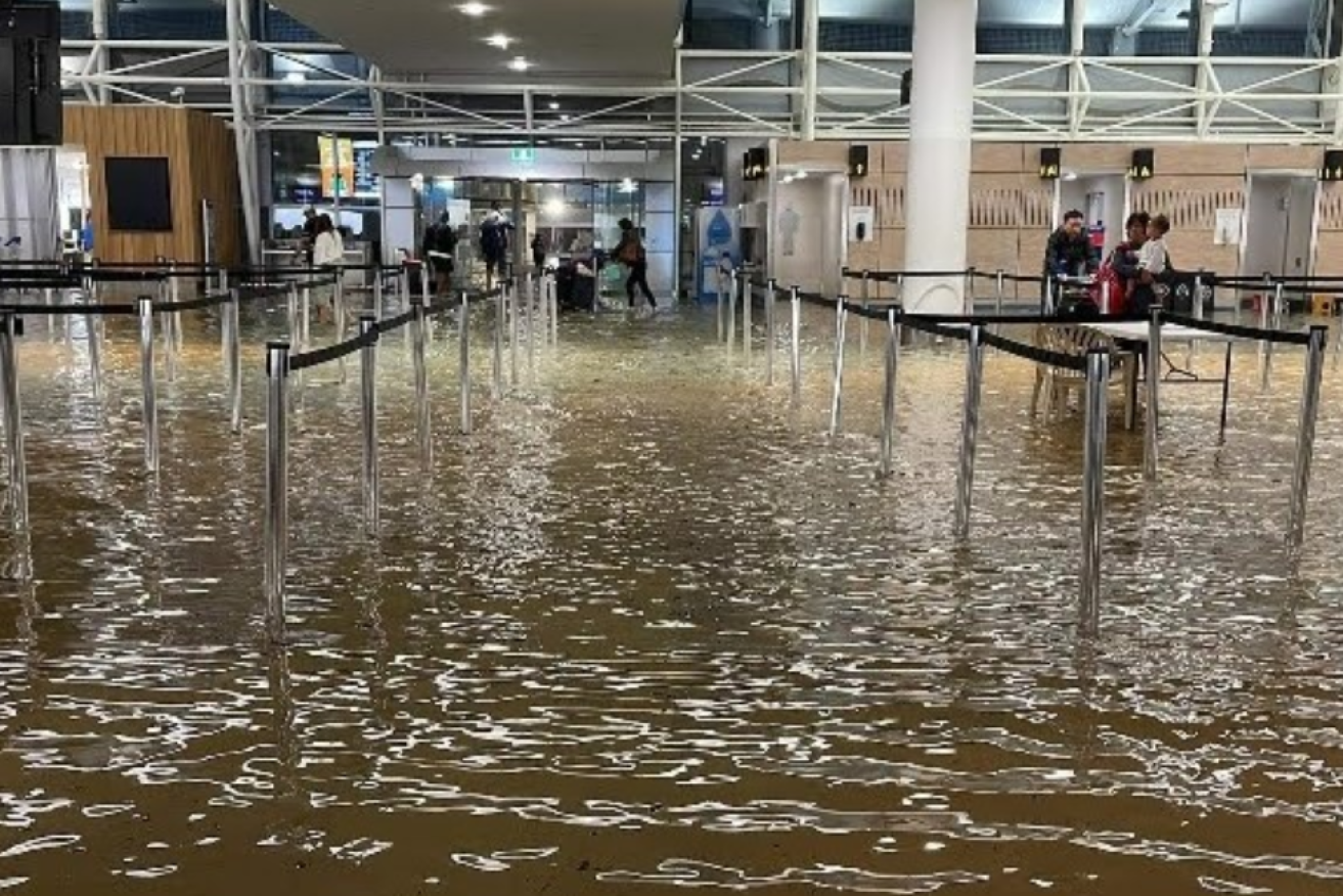Auckland Airport became an indoor lake as the rain poured down, forcing hundreds of would-be passengers to spend the night on its upper floors. <i>Photo: Vineet Kumar / Twitter</i>
