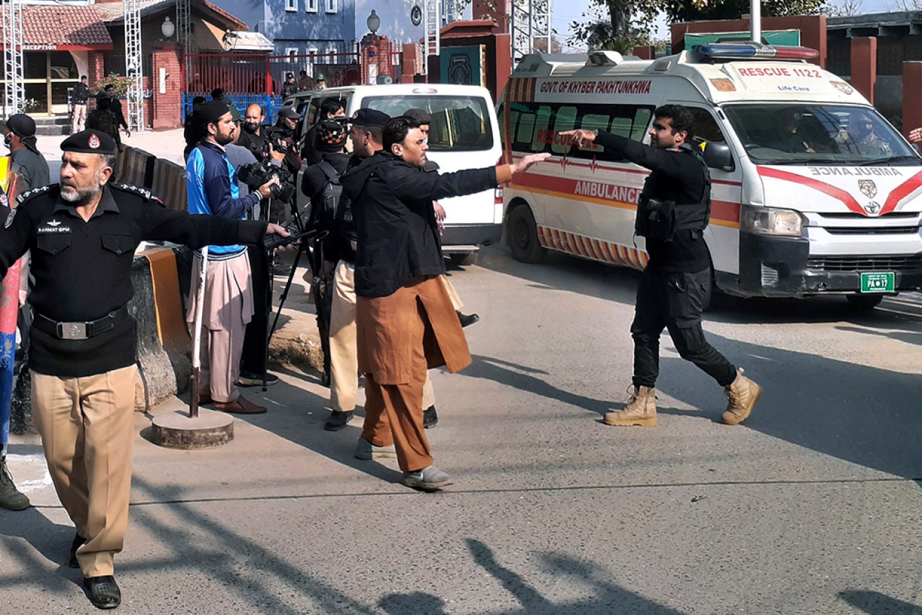 Authorities rush to get the wounded to hospital following the blast in Peshawar. 