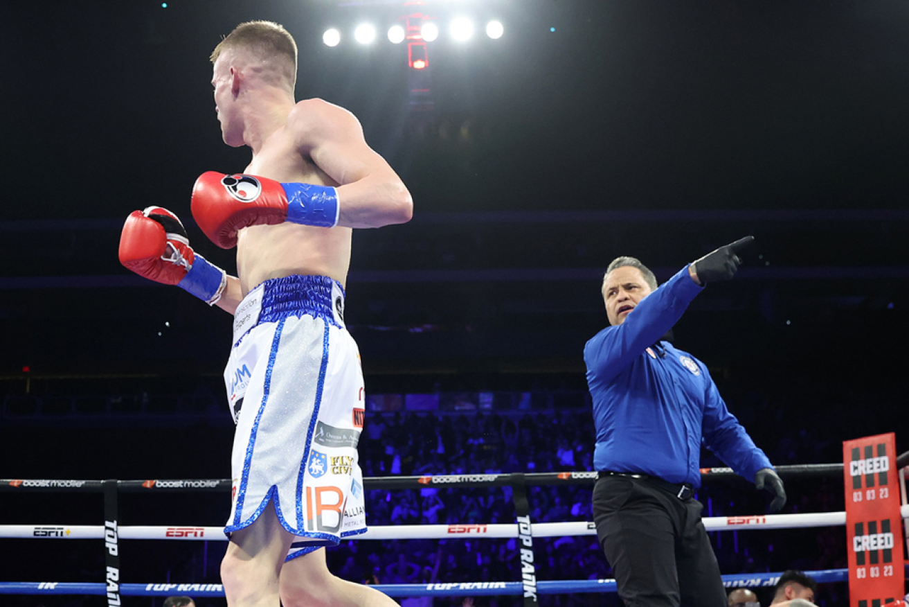 Liam Wilson is ordered to his corner after flooring Emanuel Navarrete with a powerhouse combination in the title fight's fourth round. <i>Photo: AAP</i>