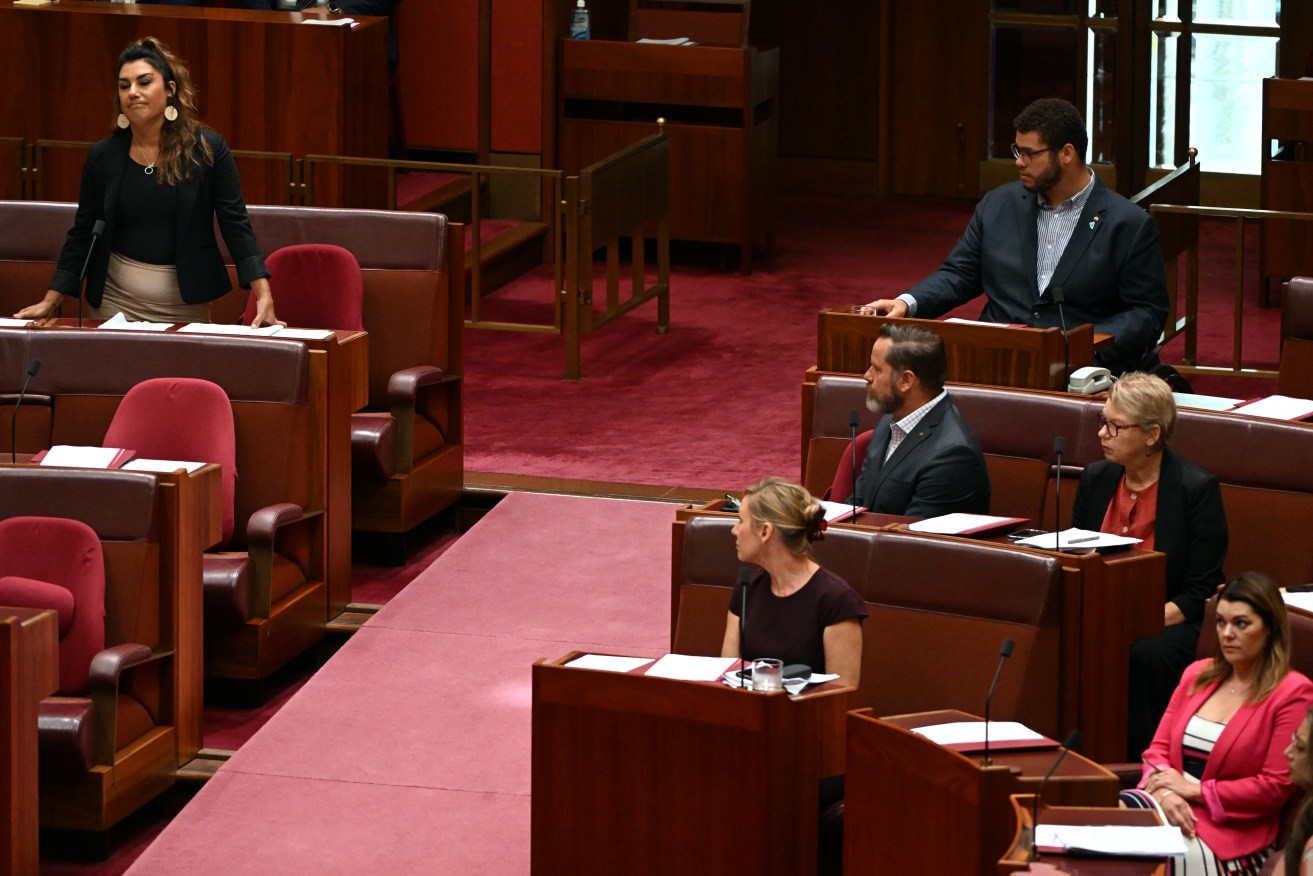 Senator Lidia Thorpe takes her new seat on the cross bench, opposite her former Greens colleagues.