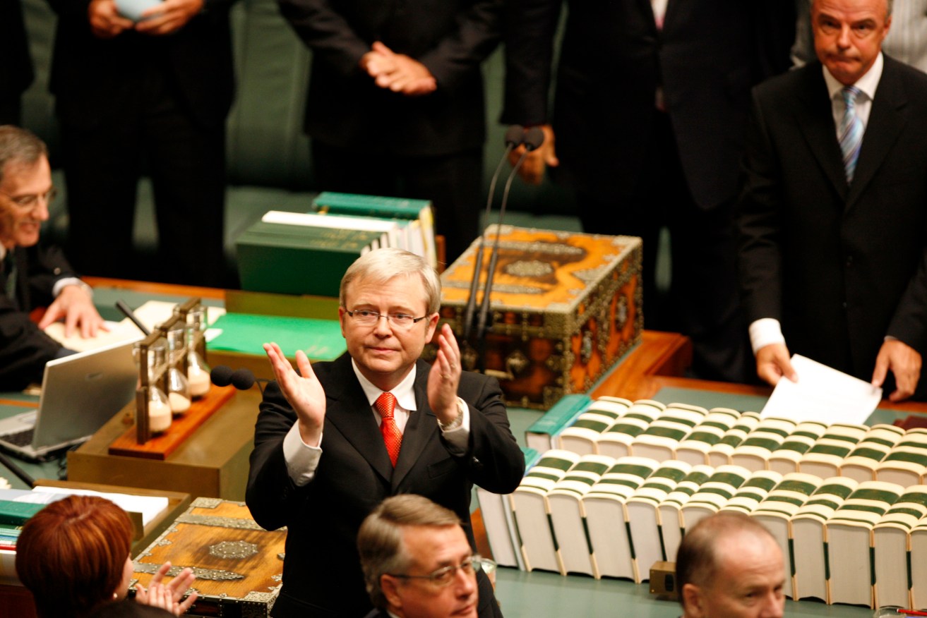 Prime Minister Kevin Rudd turns acknowledge Indigenous people after giving his apology speech in 2008.
