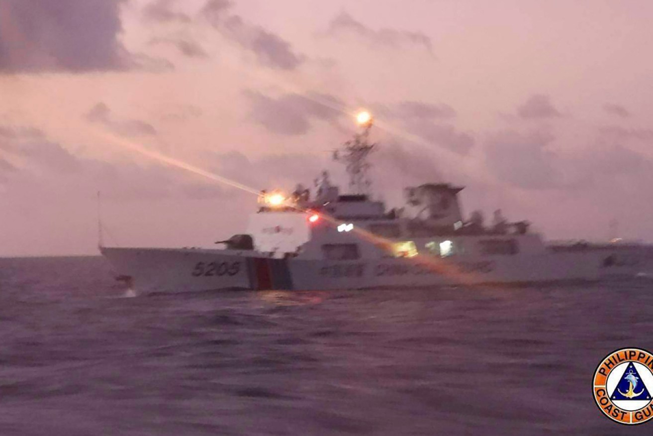 The Philippines says a Chinese coast guard vessel tried to block a ship on a resupply mission. 