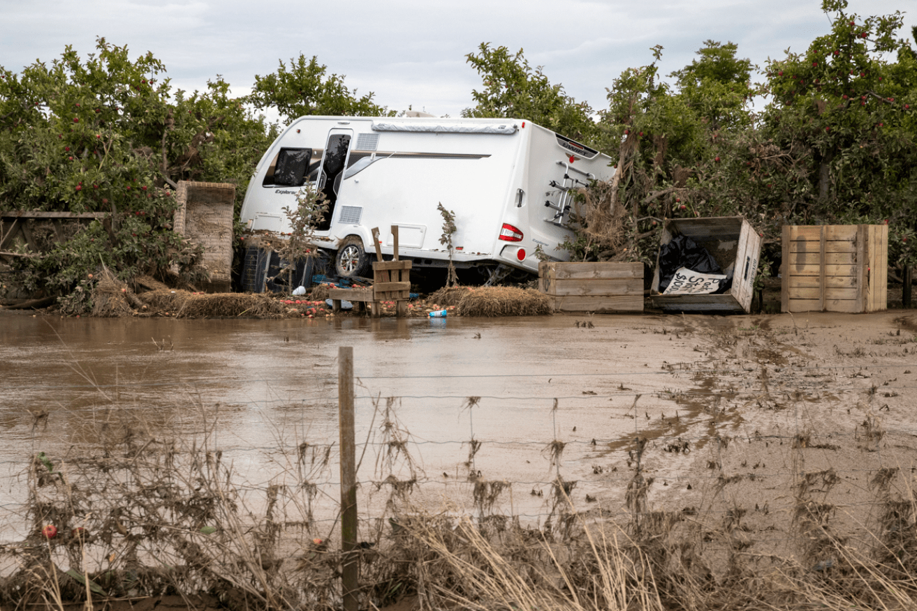 A battered caravan rests where the raging torrent left it as Cyclone Gabrielle pounded Hawkes Bay. <i>Photo: AAP</i>