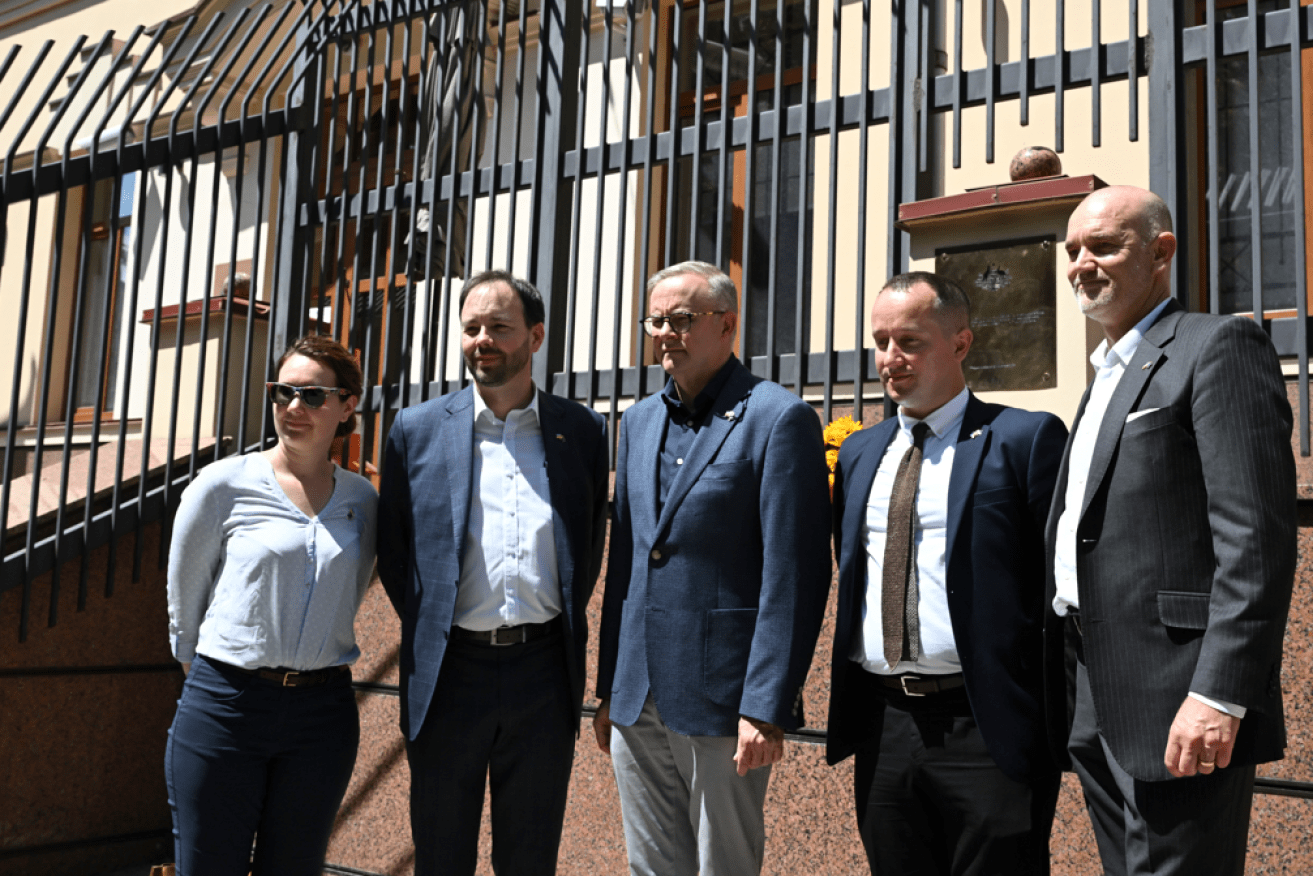 Anthony Albanese poses in July 2022 with ambassador Bruce Edwards and local staff outside the closed Australian Embassy in Kyiv. <i>Photo: AAP</i>