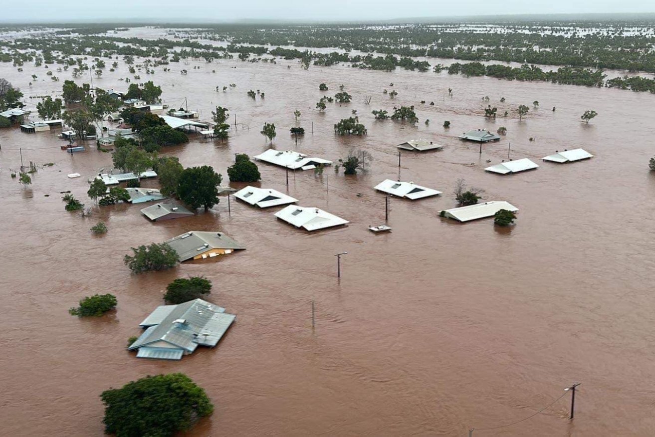 Floodwaters reach the rooftops in Pigeon Hole, in the north-west of the Northern Territory.