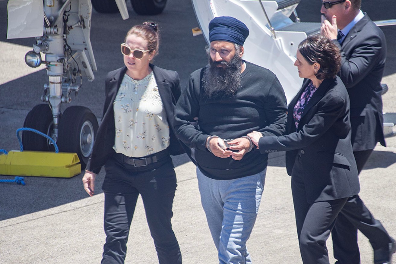 Rajwinder Singh, centre, has been charged on Thursday with the murder of Toyah Cordingley in Cairns.