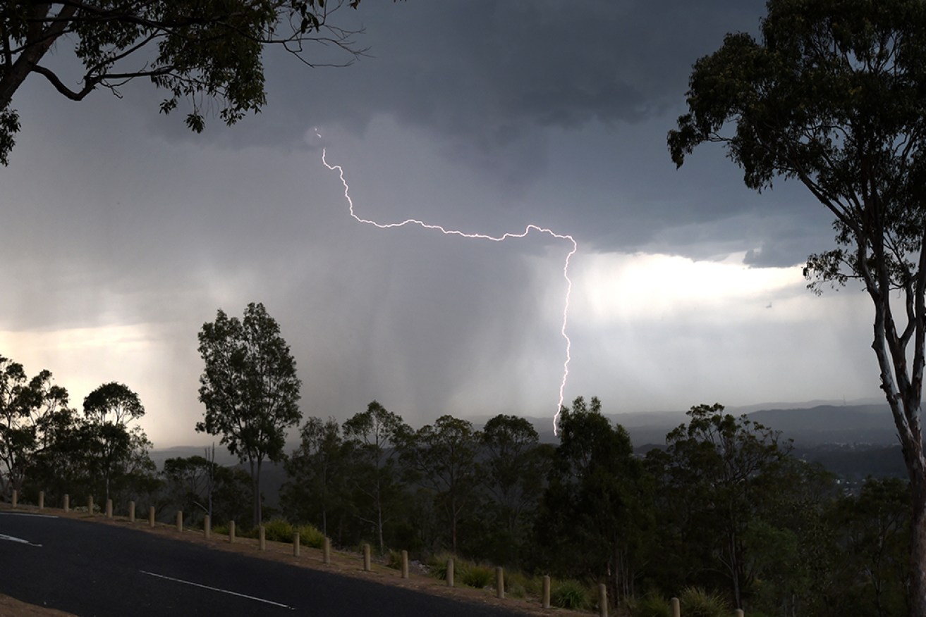 A man is fighting for his life after he was struck by lightning north of Brisbane. 