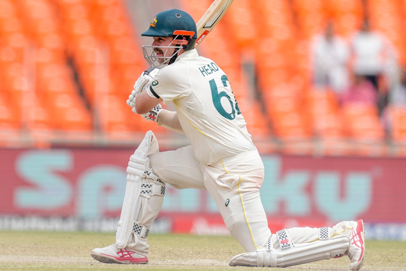 Travis Head top scored with 90 to guide Australia to safety in a drawn fourth Test against India.