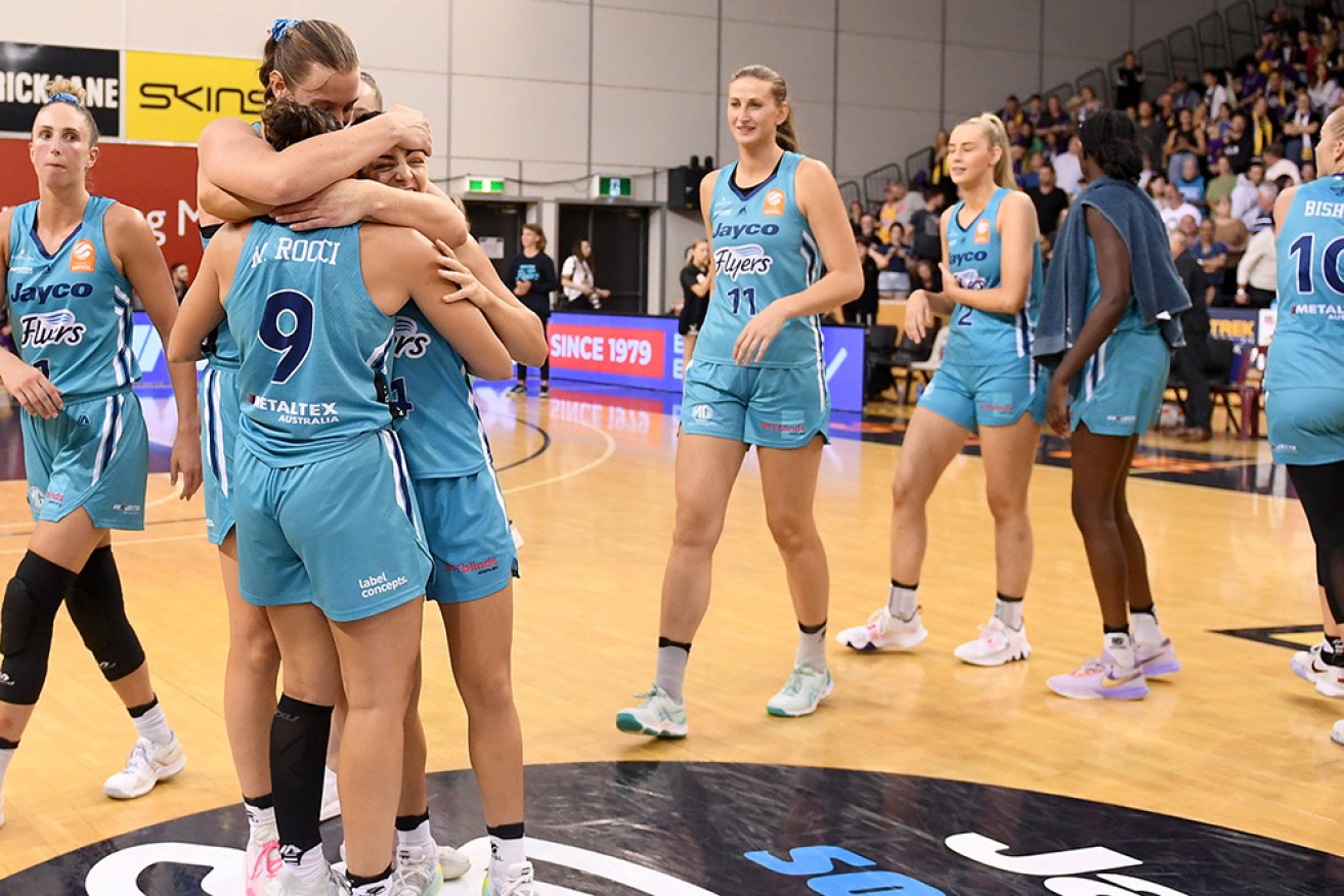 Maddi Rocci and Monique Conti of Southside Flyers celebrate after reaching the WNBL grand final on Wednesday. 