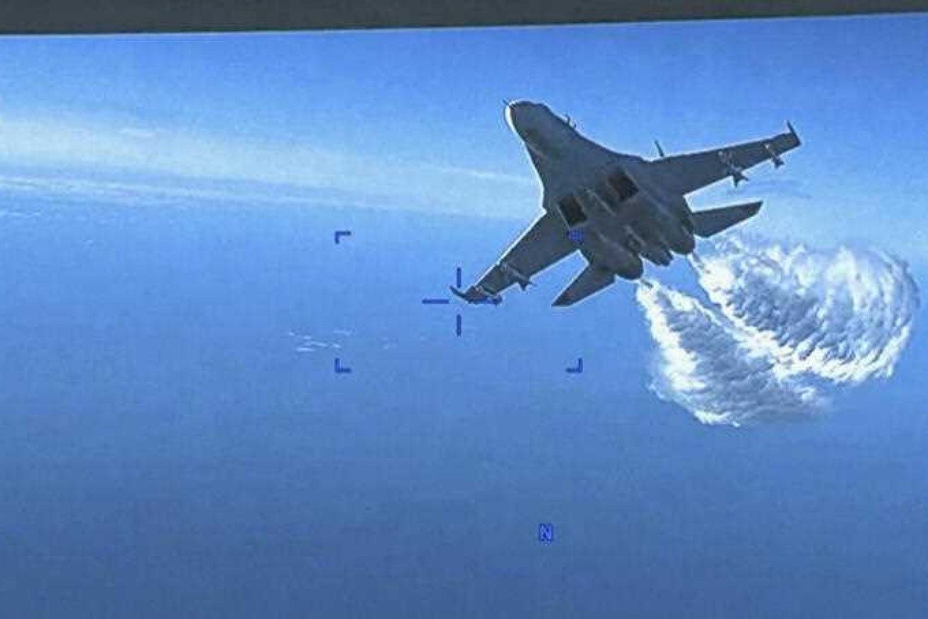 The US has released video of a Russian Su-27 approaching its MQ-9 drone over the Black Sea.