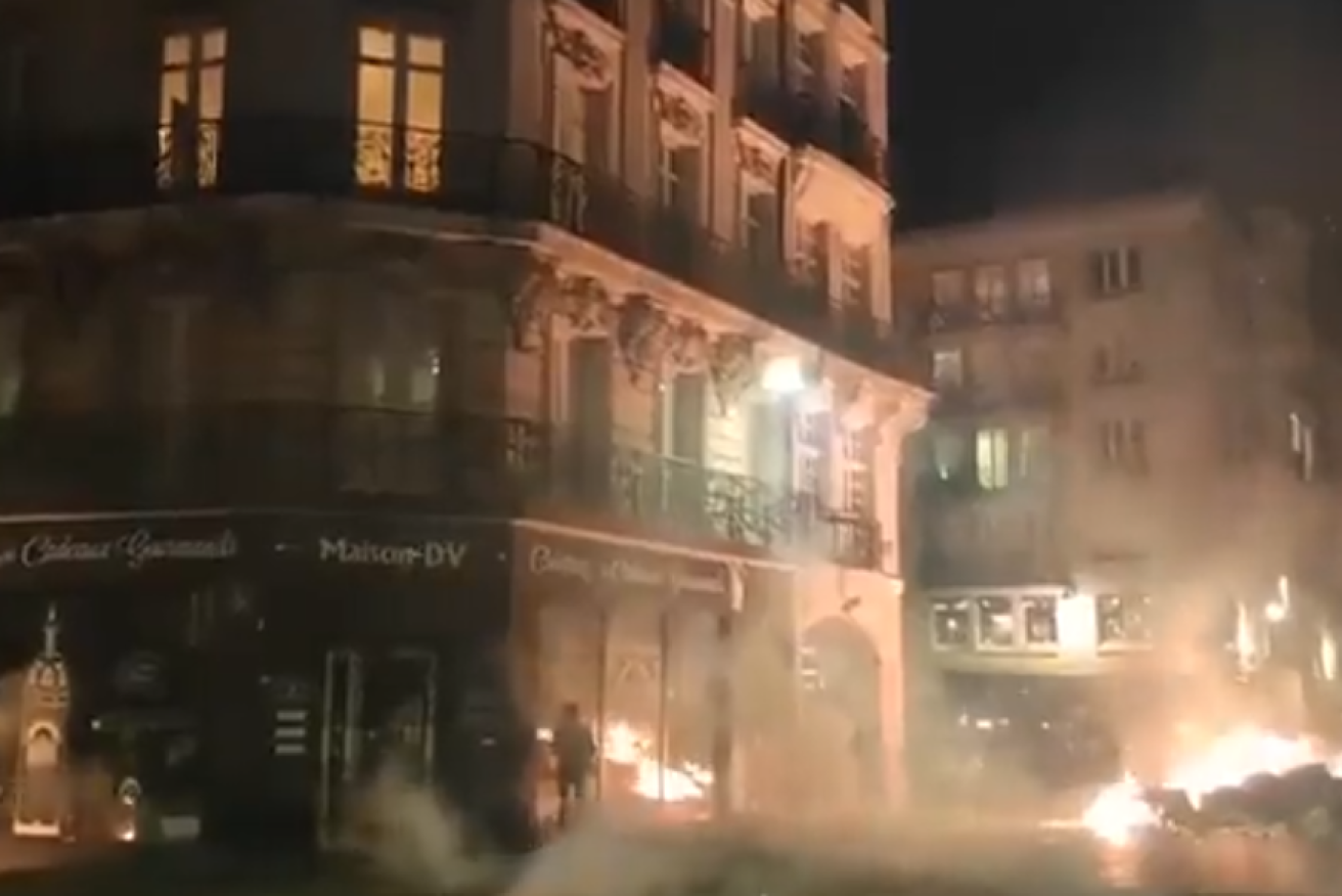 Smoke from burning cars fills the streets of Paris after days of escalating protests, strikes and riots. <i>Photo: Twitter/NextaTV</i>
