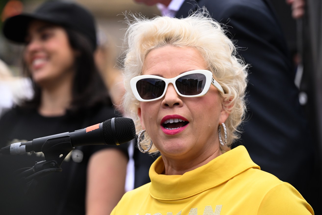 Anti-trans racist activist Kellie-Jay Keen-Minshull at the Victorian Parliament on Saturday. Embattled Liberal MP Moira Deeming is behind her.