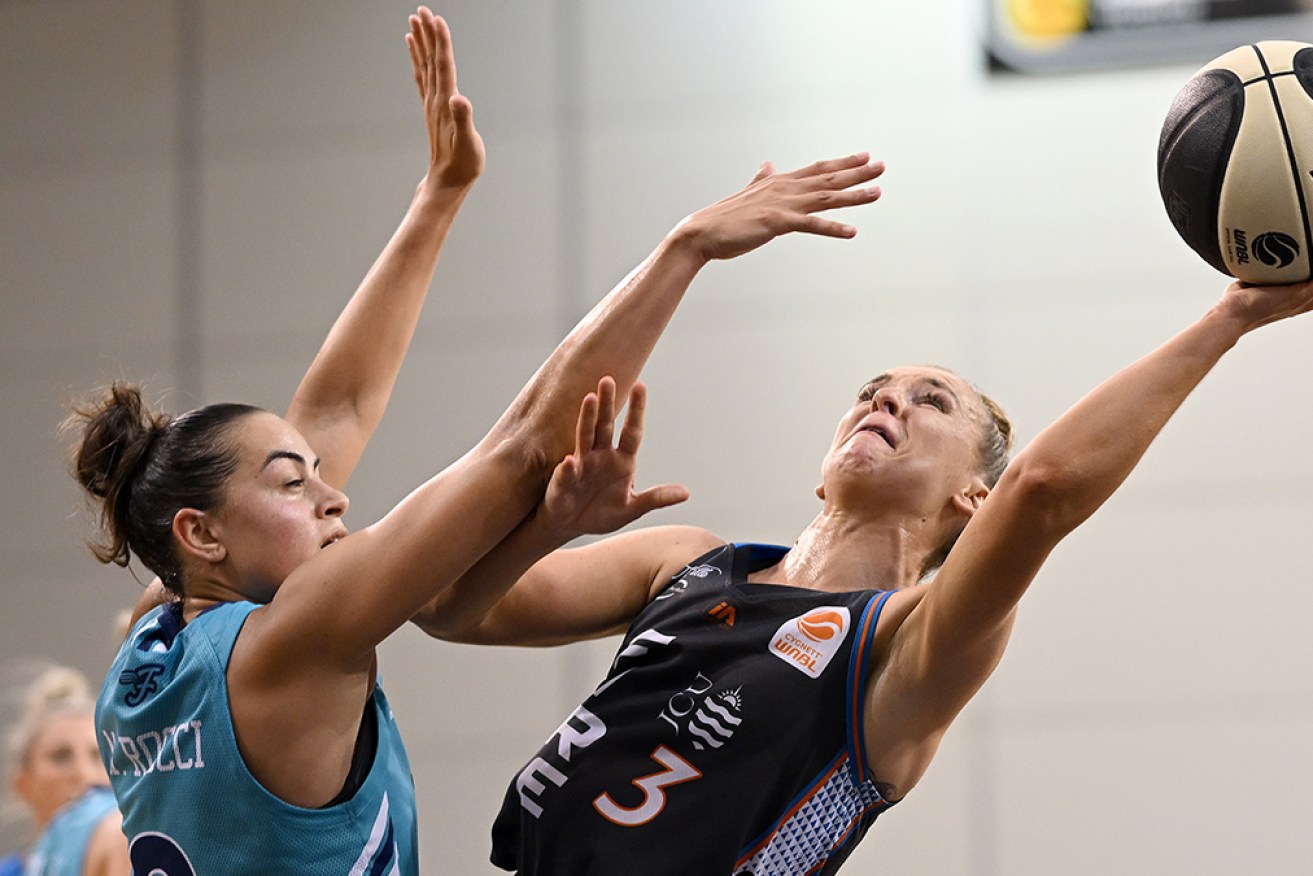 Steph Reid, right, scored 20 points for Townsville Fire in its 82-69 victory over Southside Flyers. 