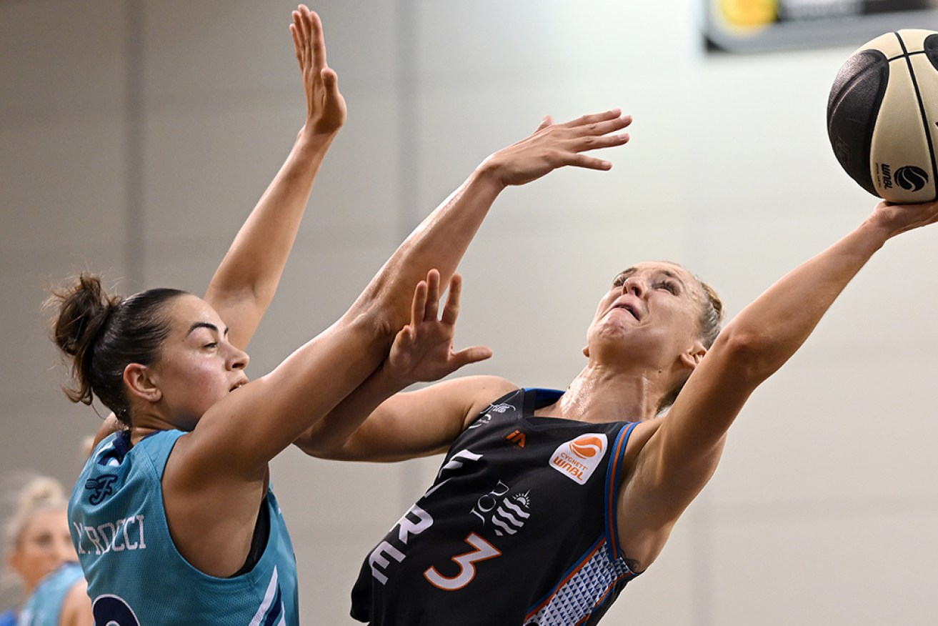 Steph Reid, right, scored 20 points for Townsville Fire in its 82-69 victory over Southside Flyers.