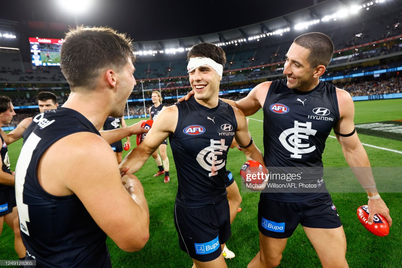 Carlton's Nic Newman, Adam Cerra and Jacob Weitering celebrate the victory over Geelong at the MCG on Thursday night.