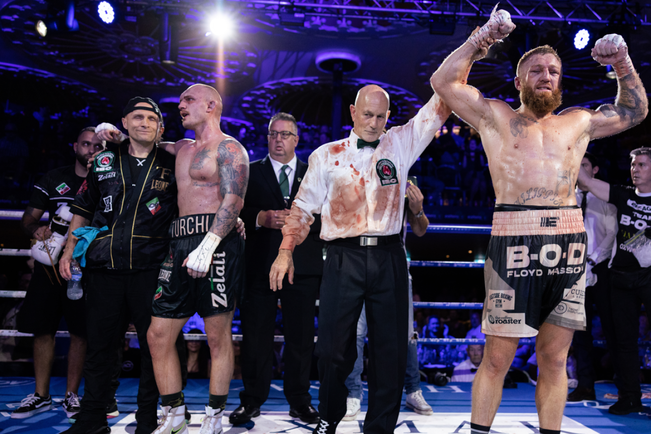 The title bout was so intense even the referee ended up covered in blood. <i>Photo: AAP</i>