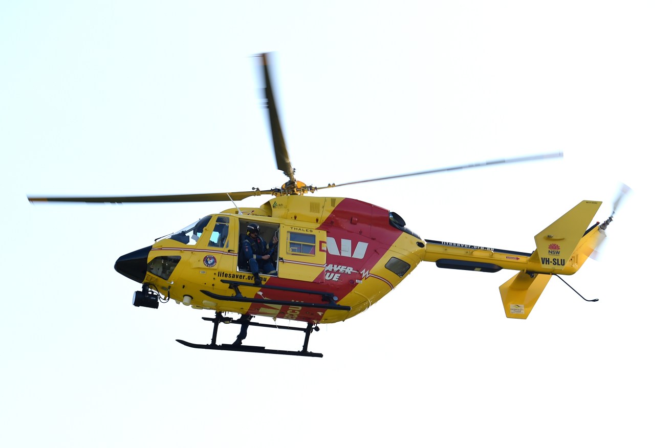 Queensland authorities saved two fishermen after their boat capsized but a third man wasn't found. 