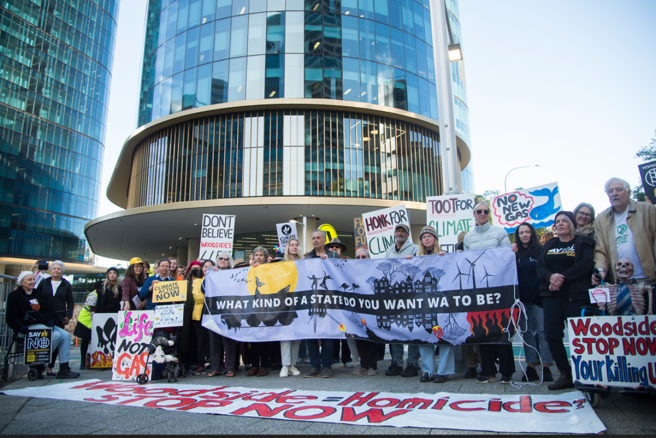 Climate activists denounce Woodside's Burrup gas hub outside the mining giant's Perth HQ. <i>Photo: AAP</i>