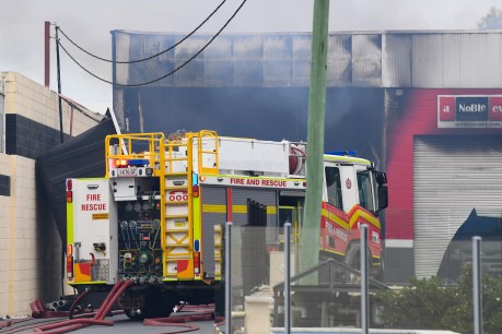 Firefighter dies after battling factory blaze