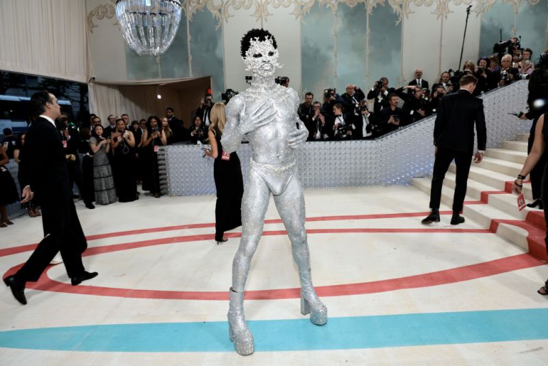 Lil Nas X covers body in silver paint, rhinestones for 2023 Met Gala